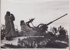 'Flak 36 Gun Crew with Wintermantels' Press photograph
